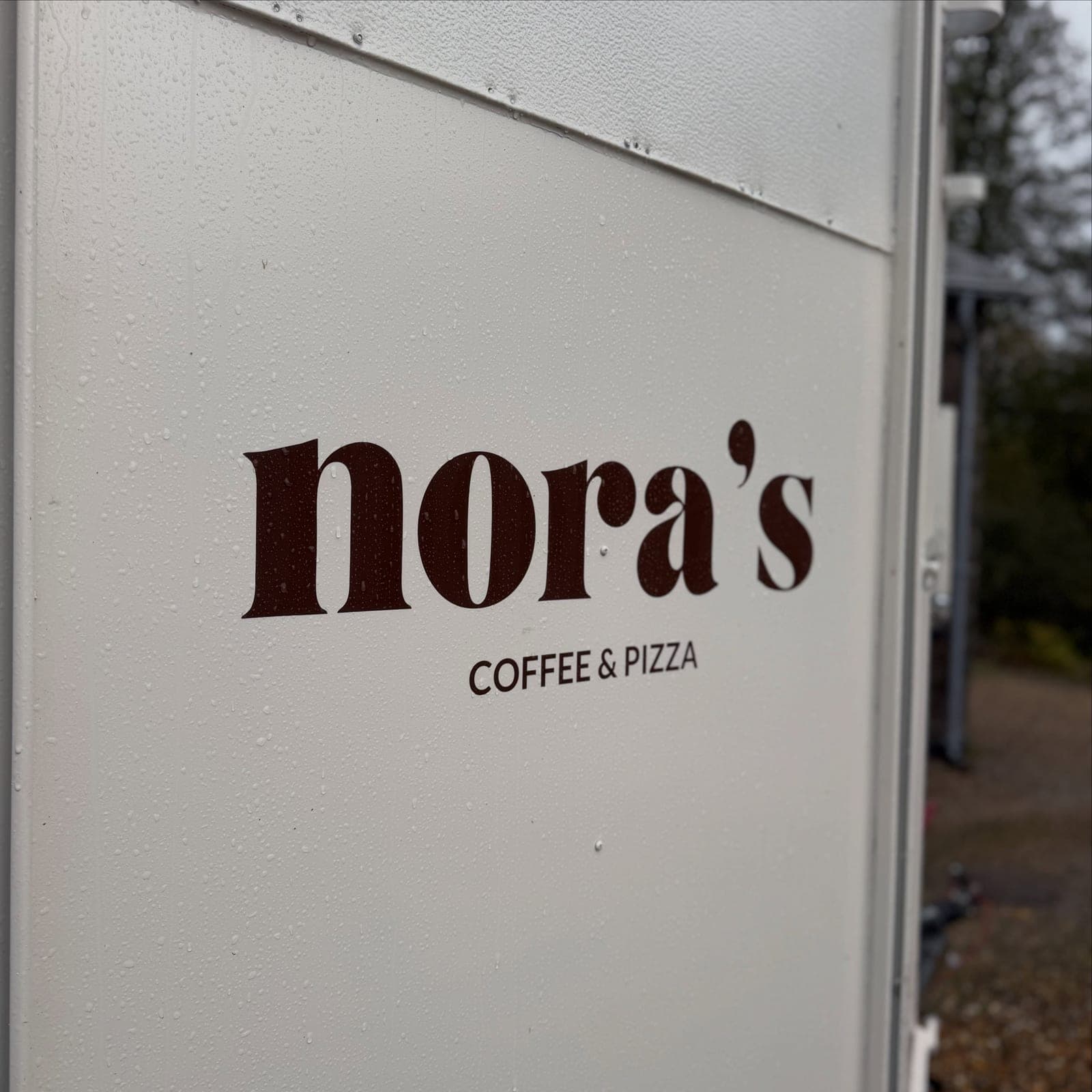 The nora’s logo on the side of the trailer